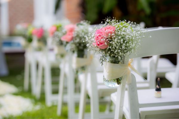 Outdoor wedding event with portable restroom trailer